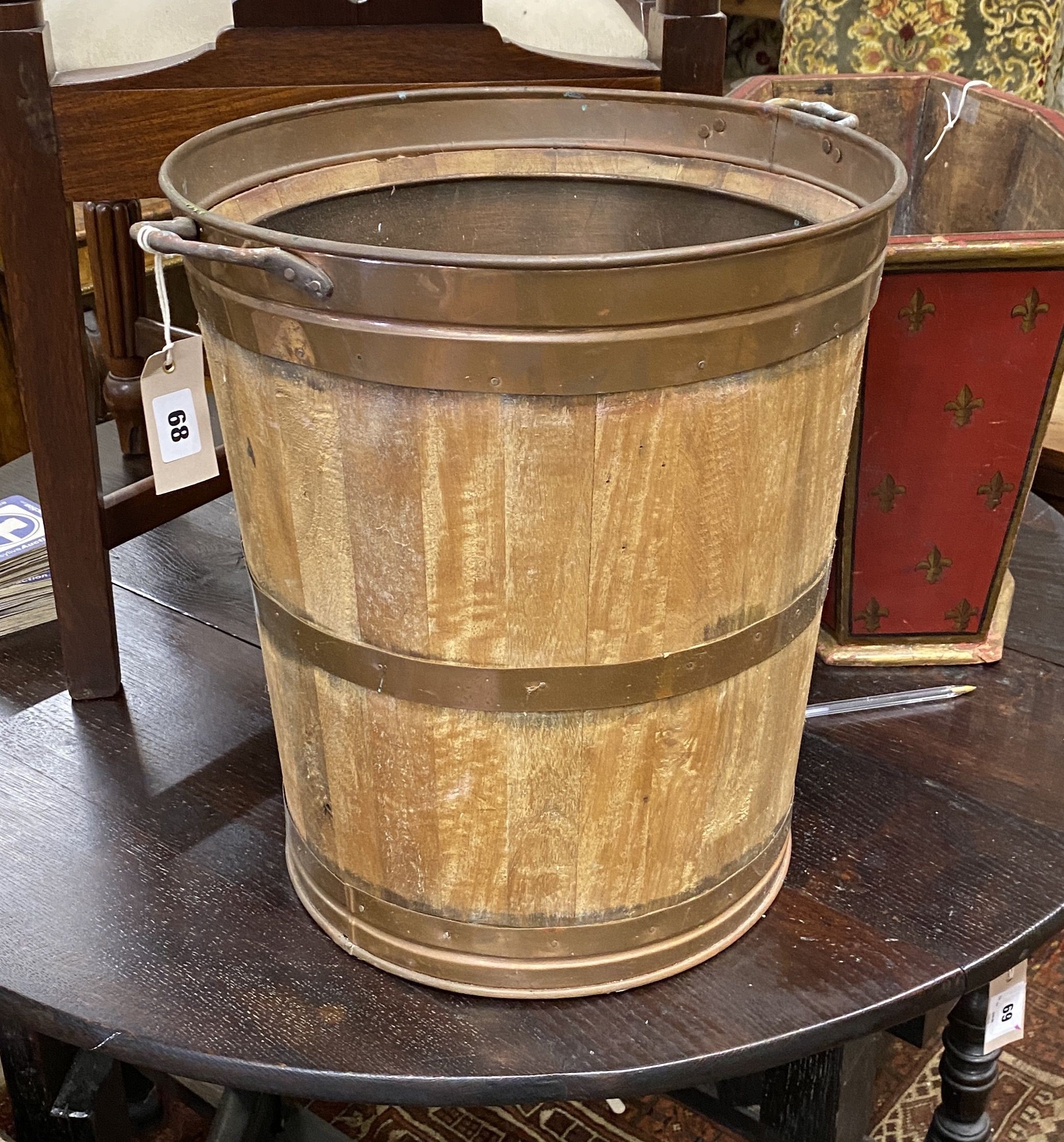 A copper bound and staved oak bucket, diameter 38cm, height 43cm